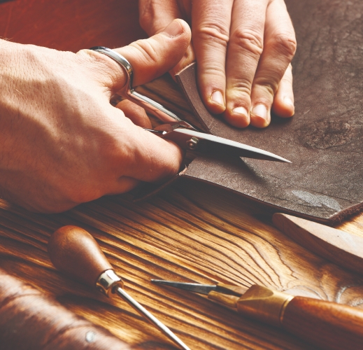 cutting leather on table